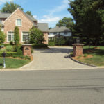 A front picture of a house with a driveway