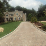 A long driveway leading to a house