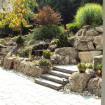 Marble steps in the backyard with a garden
