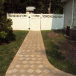 Designed walkways in front of a white gate